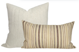 Two pillow covers: one square with textured off-white fabric, the other rectangular with tan, brown, and cream vertical stripes on woven fabric.
