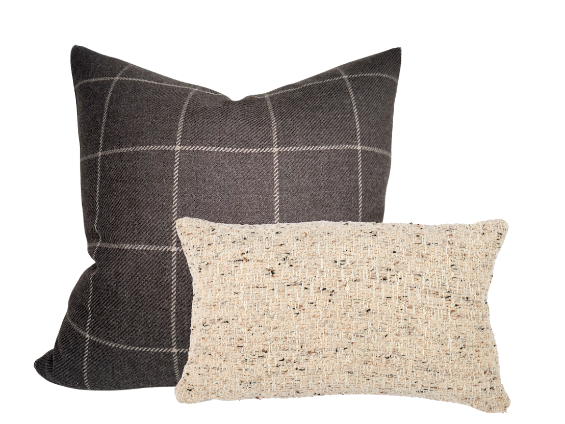 Two wool pillow covers: a larger square one with dark brown and beige plaid pattern, and a smaller rectangular one with a textured beige and brown speckled weave.