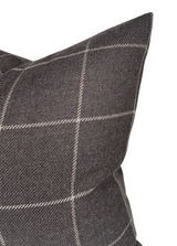 Close-up of a sable brown wool pillow cover with a subtle white windowpane check pattern and a textured woven surface.
