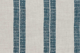 Textile pattern featuring vertical indigo stripes composed of small dot clusters on a beige background, arranged in evenly spaced pairs with subtle texture.