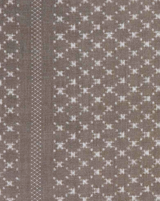 Earth grey fabric with a subtle geometric pattern of small white plus shapes and a vertical stripe of crisscross stitching on the left side.