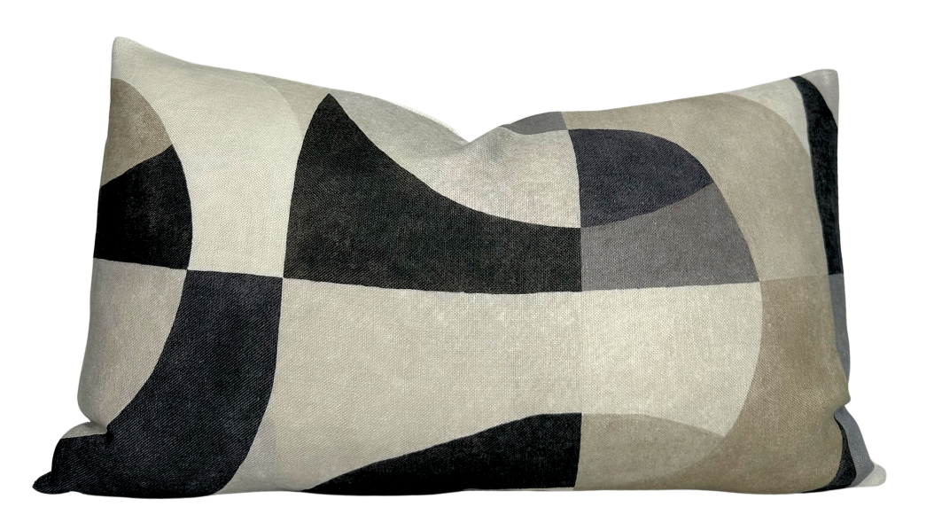 Colonnade Pillow Cover in Onyx by DEKOWE displayed on a pink textured surface
