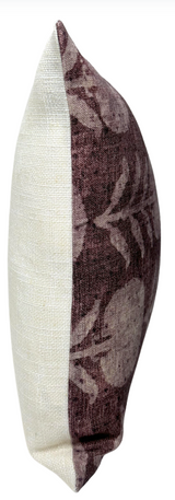 Rectangular pillow cover with one half in solid off-white fabric and the other half in textured berry fabric featuring a subtle floral pattern.