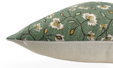 Rectangular pillow with a green floral patterned fabric on top featuring white flowers and yellow accents, and a plain beige fabric on the underside.