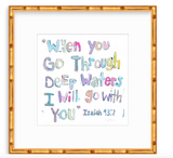 Hand-lettered Isaiah 43:2 quote with pastel colors in varied fonts on white background, framed in warm-toned bamboo-style frame.
