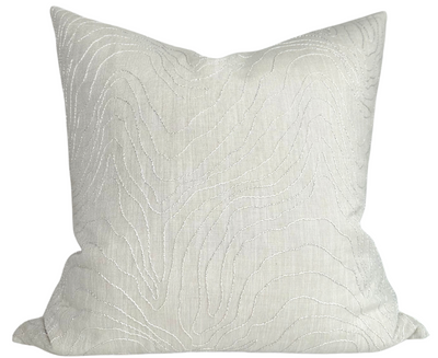 Formation Embroidered Pillow Cover in Oyster on a couch