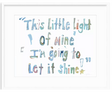 Hand-painted watercolor text in mixed pastel shades reading 'This Little Light of Mine I'm going to Let it Shine' with a small golden star on white background, framed in white.