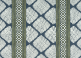 Fabric pattern with white geometric diamond shapes and olive green vertical stripes on a bluish-gray background, featuring smaller intricate diamond details within the stripes.