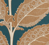 Close-up of a textile pattern featuring large ochre leaves with detailed veins and scalloped edges on a deep mineral blue background.