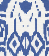 Close-up of Island Ikat pillow cover fabric with royal blue abstract geometric and diamond shapes on white background.