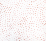 Fabric featuring a white background scattered with irregular blush pink dots varying in size and spacing, creating a delicate speckled pattern.