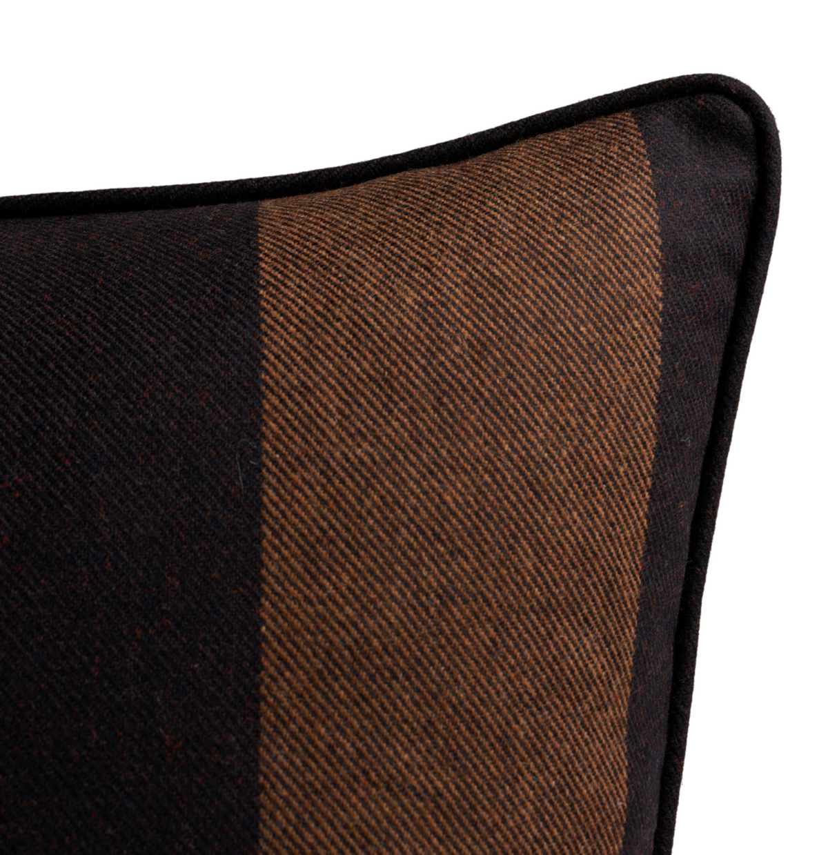 Corner detail of a rectangular woven pillow cover with wide vertical stripes in Java brown and black, featuring black piping along the edge.