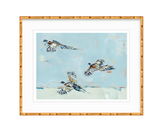 Fine art print depicting three pheasants in mid-flight against a pale blue sky, framed with a textured golden bamboo-style frame and white matting.