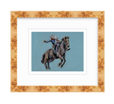 Painting of a rodeo cowboy riding a bucking horse against a muted blue background, framed by a light wood frame with a white mat.