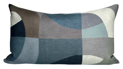 Colonnade Pillow Cover in Blue displayed on a sofa showing blue patterned front and ivory linen back