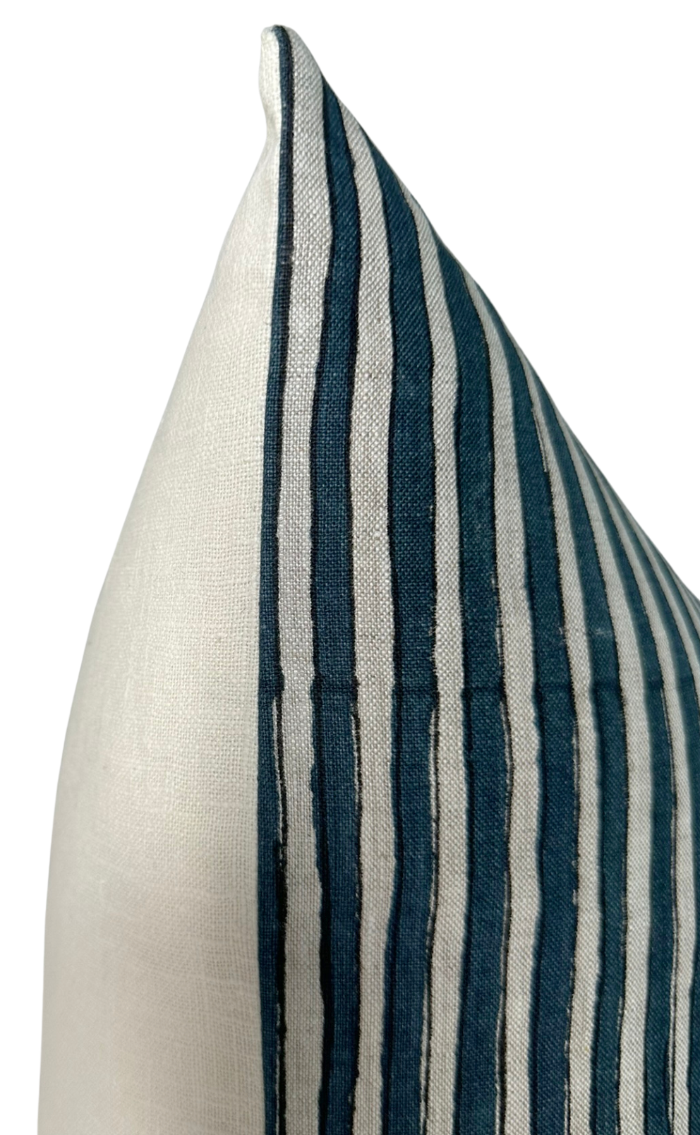 Corner of a pillow cover with alternating thick and thin Indian teal stripes against an off-white background, showing texture and fine stitching detail.