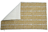Rectangular pillow cover with saffron-colored woven fabric featuring repeating white and gray branch-like patterns, folded to show plain off-white reverse side.