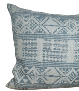 Rectangular pillow cover with intricate mist blue geometric and diamond patterns on a light beige woven background, featuring textured fabric details.