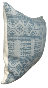 Rectangular pillow cover with a soft mist blue and cream geometric pattern on a textured fabric, shown from a side angle highlighting its thickness and shape.