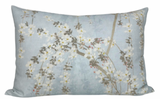 Rectangular pillow cover with pale blue background featuring delicate white and gray blossom branches cascading across the fabric in a soft, natural pattern.