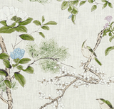 Floral and bird pattern on light lavender fabric featuring green leaves, pine needles, white blossoms, blue flowers, and two small birds perched on branches.