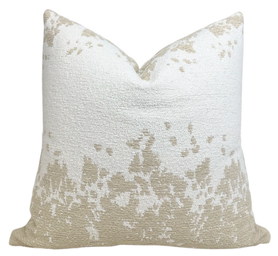 Dappled Stripe Pillow Cover in Oyster displayed on a white textured surface, showing woven dappled stripe pattern and ivory backing.