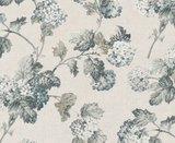 Pattern of slate and blue hydrangea clusters with detailed leaves on a soft beige background, showing a classic botanical textile design.