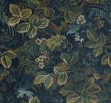Midnight blue pillow cover with intricate green and teal leafy botanical pattern interspersed with small white flowers, creating a lush garden effect.