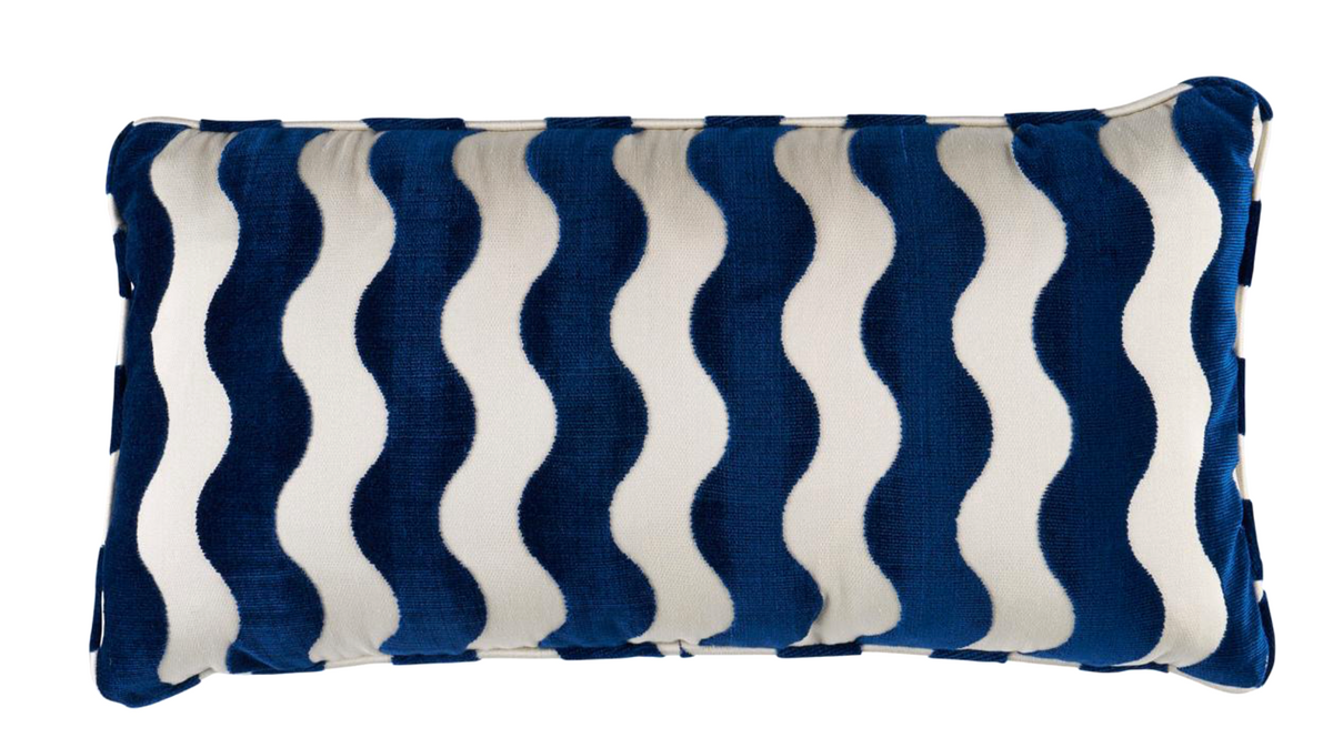 Wave Velvet Pillow Cover in navy blue with wave pattern, displayed on sofa