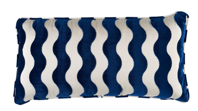 Wave Velvet Pillow Cover in navy blue with wave pattern, displayed on sofa