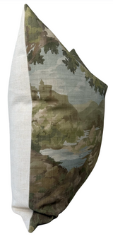 Square pillow with a nature-themed print showing leafy tree branches and a muted green landscape, paired with a plain light beige fabric on the side.