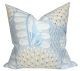 Square pillow cover with a spa blue background featuring abstract floral patterns in cream, white, and various shades of blue.