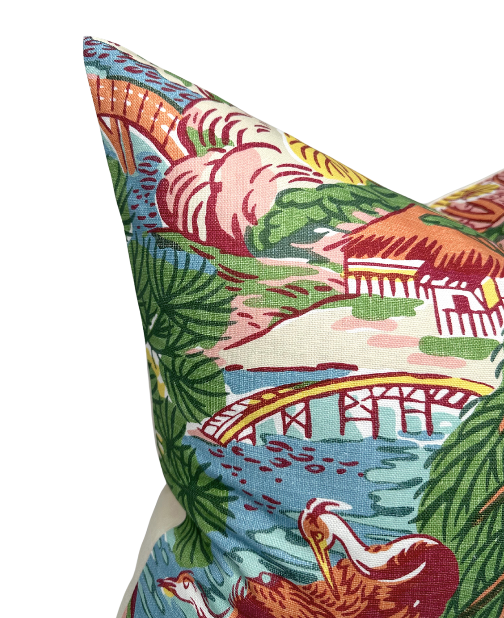 Decorative pillow cover with a coral pagoda design featuring red bridges, blue water, lush green foliage, and blooming pink flowers.
