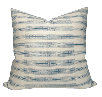 Indro Pillow Cover in Lake on Natural featuring printed front and ivory linen back shown in interior setting