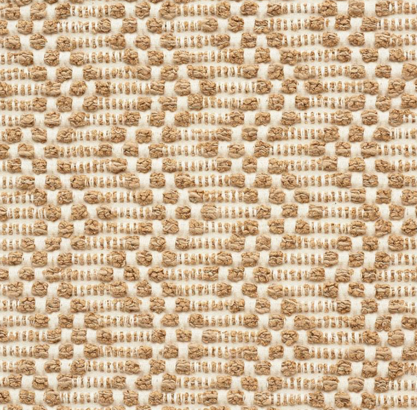 Close-up of Audley woven pillow cover fabric in sand tones, featuring a textured geometric pattern of raised loops and stitched rectangles in beige and cream.