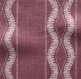 Close-up of woven fabric in deep reddish-purple with vertical wavy white lines and fine vertical stripes in a repeating pattern.