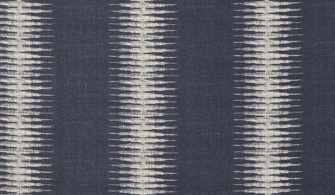 Charcoal background fabric with vertical ivory ikat stripes creating a blurred, geometric pattern with repeating diamond shapes.