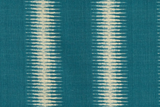 Teal fabric with vertical cream-colored ikat patterns featuring symmetrical, elongated diamond shapes in repeating columns.