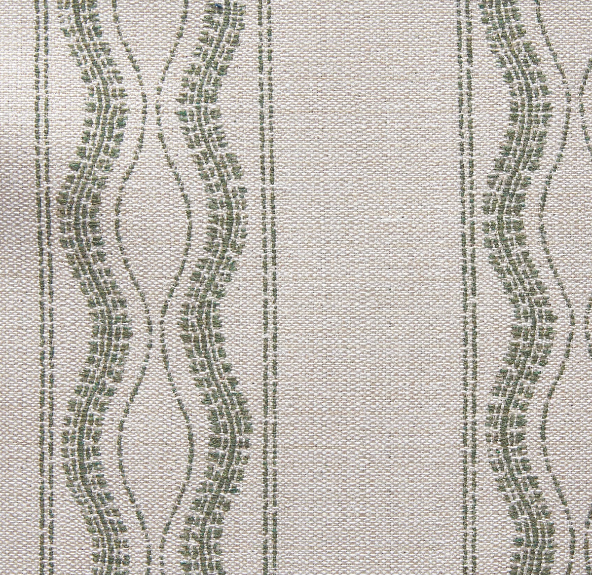 Close-up of fabric with green wavy and straight vertical lines on a light beige textured background, showing a woven pattern.