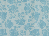Fabric with a repeating pattern of blue floral silhouettes and leaves on a light blue textured background.