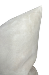 Close-up of a pearl-colored Casablanca fabric pillow cover with smooth, slightly textured linen material, showcasing its pointed corner and subtle sheen.