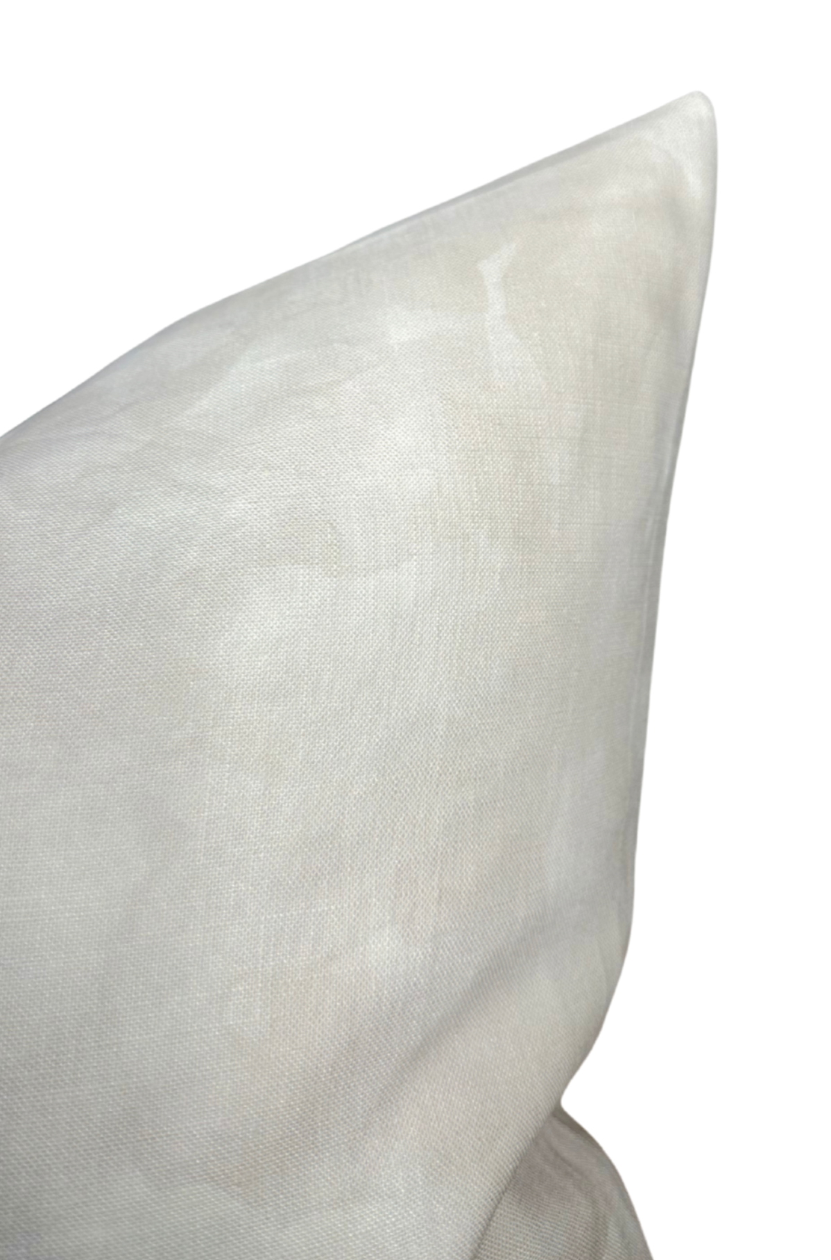 Close-up of a pearl-colored Casablanca fabric pillow cover with smooth, slightly textured linen material, showcasing its pointed corner and subtle sheen.