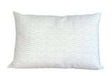 Sweetgrass Pillow Cover with floral pattern on front and ivory linen on back displayed on a sofa