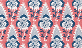 Repeating floral pattern with dark blue flowers and leaves on a white background, outlined by red shapes with a dotted texture inside them.