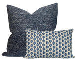 Two Cadiz pillow covers by Walter G Textiles, one large square in textured blue fabric and one smaller rectangular with blue and white repeating pattern.