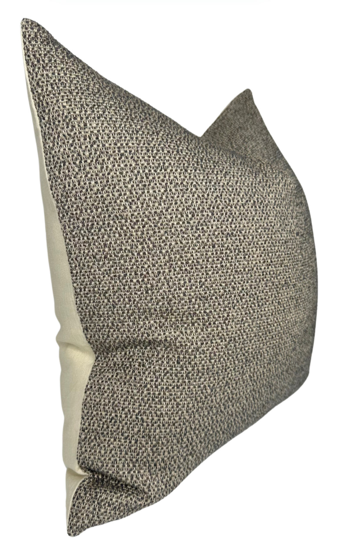 Rectangular pillow cover with a nubby charcoal and beige woven front and smooth beige fabric on the sides, shown at a slight angle.