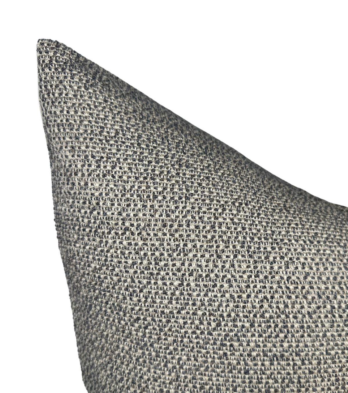 Close-up of a charcoal-colored woven pillow cover with a nubby textured fabric in a pointed corner view.