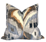 Square velvet pillow cover with an abstract pattern in shades of gray, blue, beige, and brown, featuring soft, wavy lines and irregular shapes.