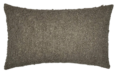 Close-up view of GILA Boucle Pillow Cover in brown showing textured fuzzy woven fabric front and ivory linen back