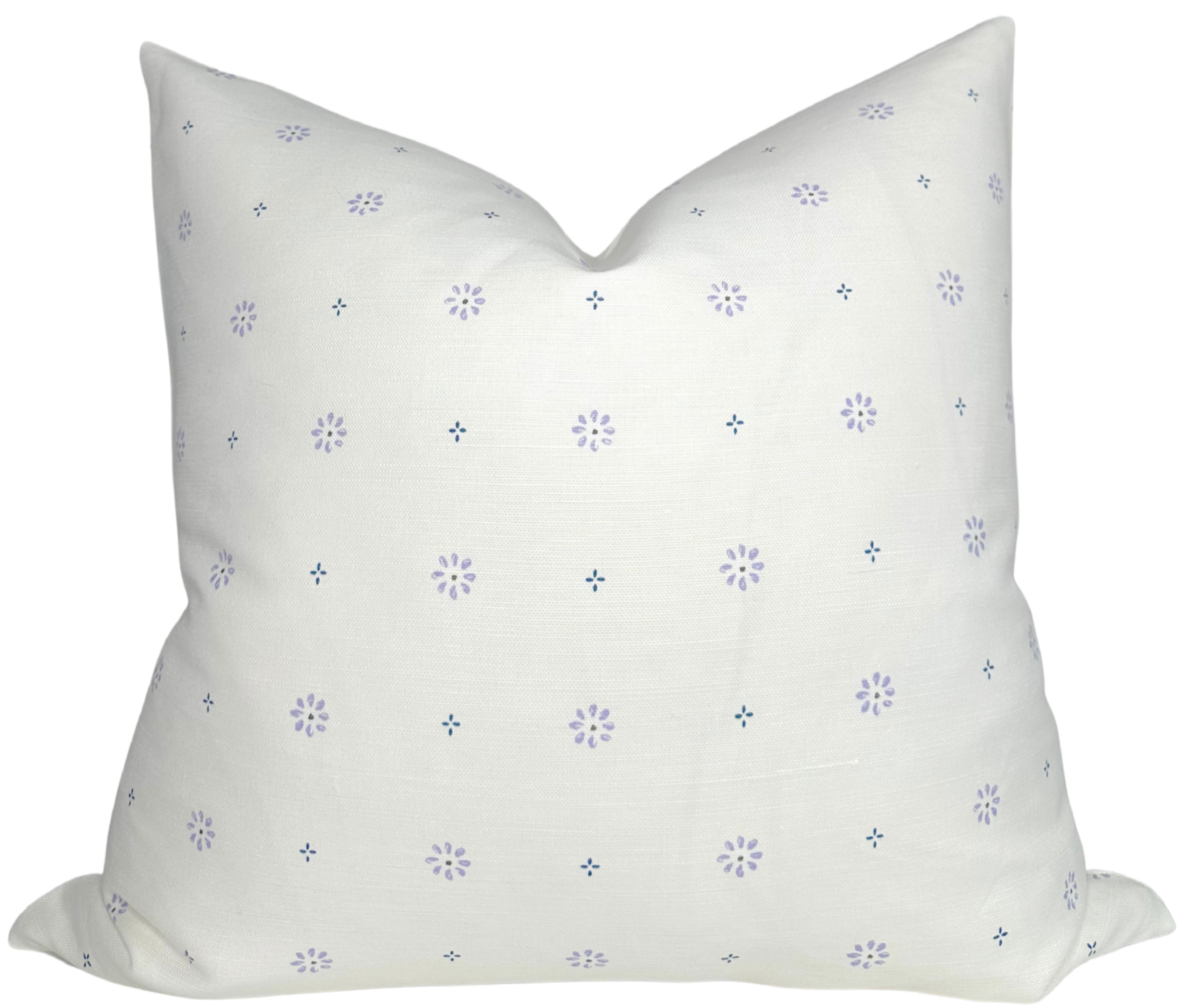 SUNA Floral Pillow Cover in Lilac with printed floral front and ivory linen back displayed on sofa